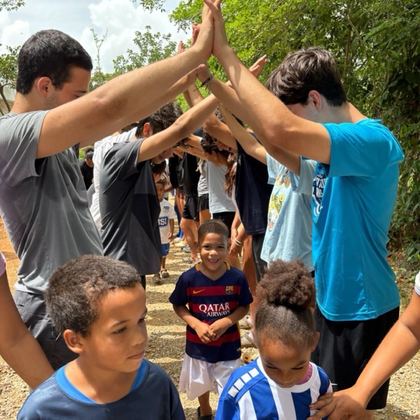 Team members making a tunnel for kids in the Dominican Republic